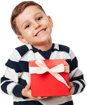 kid smiling while holding a present