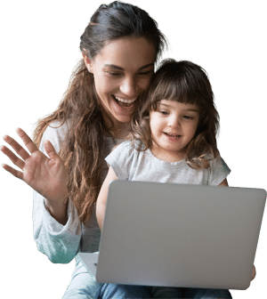 Mother and daughter smiling in front of a laptop computer